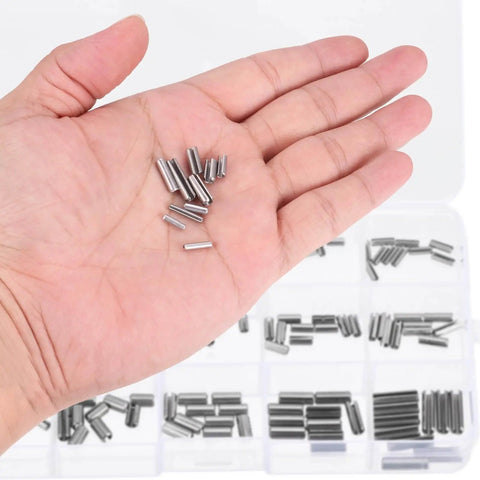 Hand holding slotted spring pins in front of a box labeled Roll Pin Set 220 Piece Slotted Spring Pins 304 Stainless Steel Rust Resistant Heavy Duty