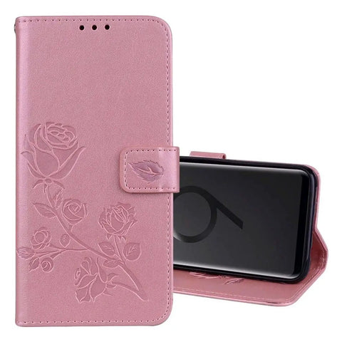 Pink floral embossed phone case with kickstand, showing closed front view and open side view with a smartphone in place.