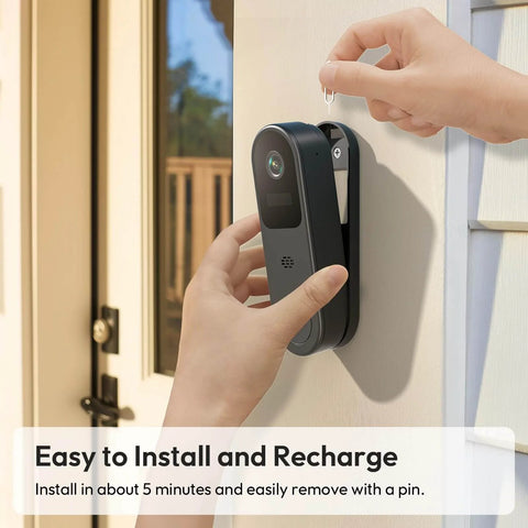Installing 2K HD Battery Wireless Doorbell Camera With Ring Chime on home exterior using a simple pin for secure attachment.