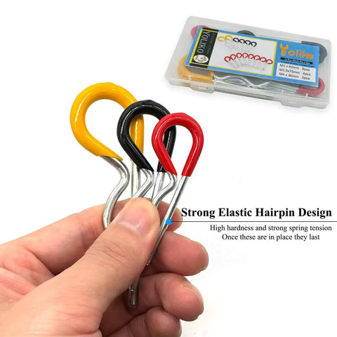 A hand holding the Heavy Duty Hitch Pins R Clips Set 14Pcs Rubber Coated Spring Retaining Pins showing various sizes and rubber-coated handles.
