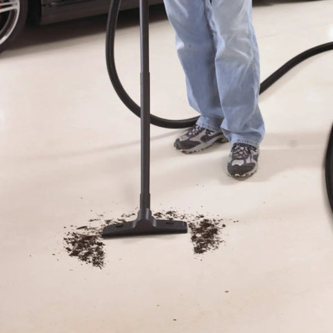 Person using 1.5 Inch Diameter Wet Dry Vacuum Accessory Kit With 2 Extension Wands, Elbow Grip, And 12 Inch Floor Nozzle for cleanup