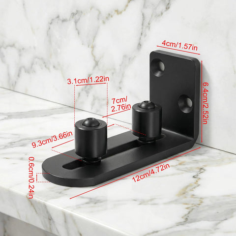Rock Solid Barn Door Floor Guide 2 Pack With Adjustable Stay Rollers installed, showing black flat bottom flush mount on marble.