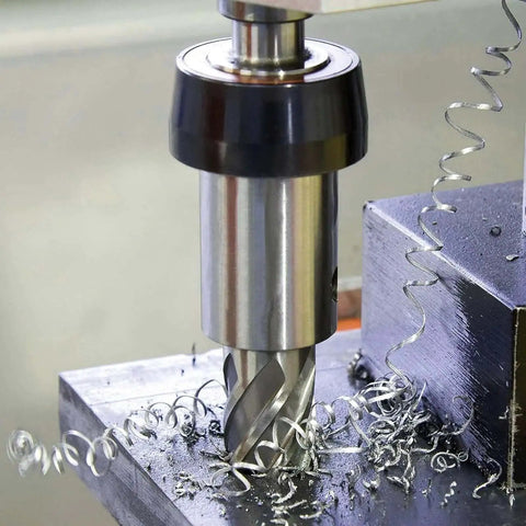 Premium Magnetic Drill Annular Cutter Set With Six Pieces Weldon Shank Bits cutting into metal showing spiral shavings
