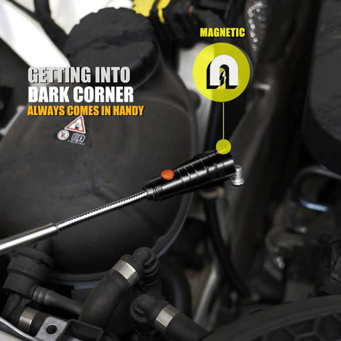 Magnetic Pickup Tool With Telescoping Magnet And Flashlight reaching into a dark car engine corner to retrieve small metal object.