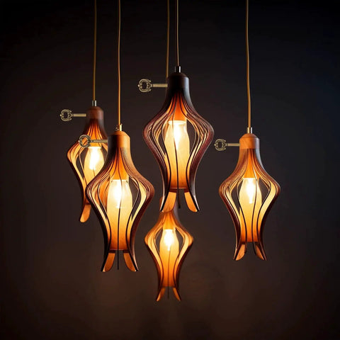 Modern pendant lights with wooden design and warm lighting in a dark room.
