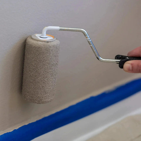 Applying paint near Clean Release Blue Painter's Tape 0.94 Inch Wide 60 Yards For Sharp Lines on wall edge