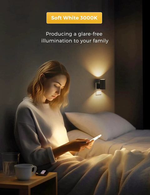 Person reading in bed with Plug In Night Light 2 Pack Dusk To Dawn Sensor Dimmable 3000K Vintage Black on wall.