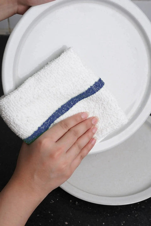Bar Mop Towels Value Pack Of 60 16x19 Inches Absorbent And Durable Cleaning Rags being used to wipe a white plate