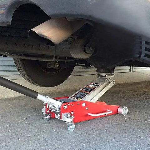Floor Jack Pad Adapter For Pinch Weld And Side Frame Protection 2 Ton Capacity installed on red floor jack lifting vehicle