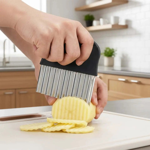 Person using a Stainless Steel Crinkle Cutter for Veggies and Fries With a Sharp Wavy Blade for Uniform Crinkle Cuts and Easy Fry Cutting.