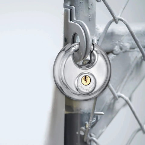 Stainless Steel Discus Padlock With Three Eighths Inch Hardened Shackle For Sheds, Garages, Fences And Storage Units installed on gate