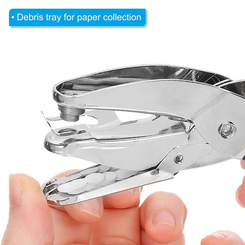 Close-up of pink 1/16 Inch single hole punch handheld paper puncher showing soft grip and debris tray, ideal for crafts.