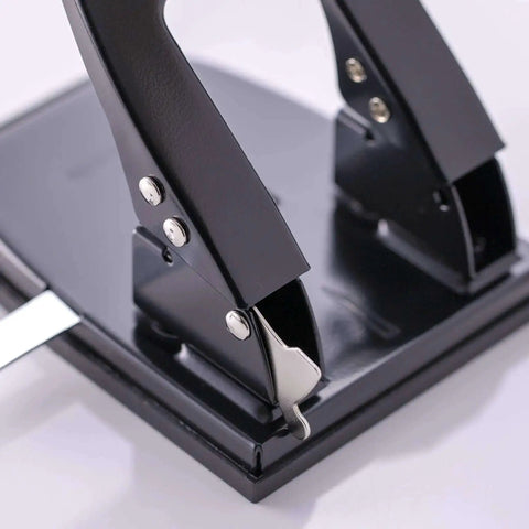 Close-up of the Workhorse Two Hole Puncher for Paper with 30 Sheet Capacity Adjustable Guide and Locking Mechanism