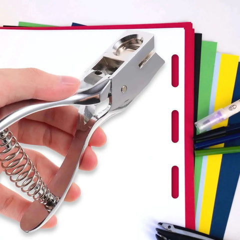 Hand using Oval Hole Puncher Manual Metal Paper Punch Tool on colorful sheets