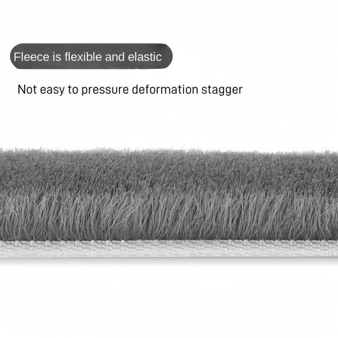 Close-up of gray weather stripping door seal for exterior doors and windows, 33 ft self adhesive winter insulation strip.