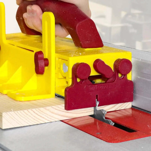 GrabberPRO Push Block For Table Saws, Router Tables, Band Saws, And Jointers With Kickback Reduction And Superior Control, Fully Adjustable Interchangeable Legs In 1in, 1/2in, 1/4in, 1/8in By Milescraft in use on table saw cutting wood, side view.