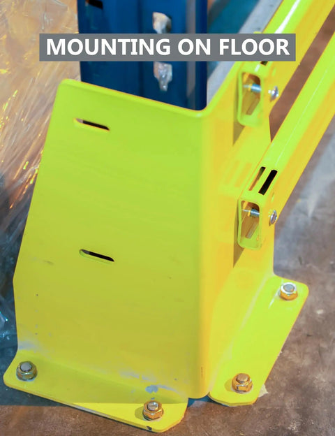 Close-up of heavy duty drop-in anchors installed on floor, supporting yellow safety barrier, using zinc-plated expansion anchors.