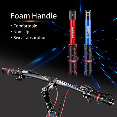 Two foam handle grips, black with red and blue markings, displayed above a bike handlebar. Features comfort, non-slip, and sweat absorption.