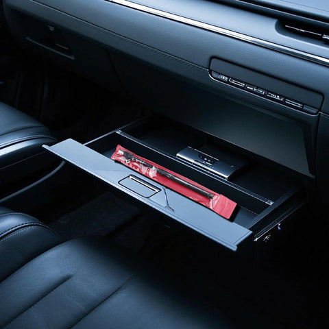 GODESON dual-head pencil tire pressure gauge, 2-pack in red blister packaging, inside car glove box.