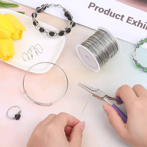 A person crafting with 20 Gauge Stainless Steel Jewelry Wire, Tarnish Resistant 304 Stainless, focusing on jewelry making.