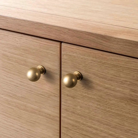 Six Pack Zinc Alloy Drawer Knobs 0.94 Inch Diameter Champagne Bronze Cabinet Knobs installed on wooden cabinets