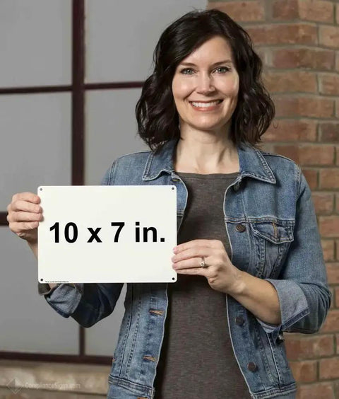 Person holding a blank 10x7 inch sign indoors