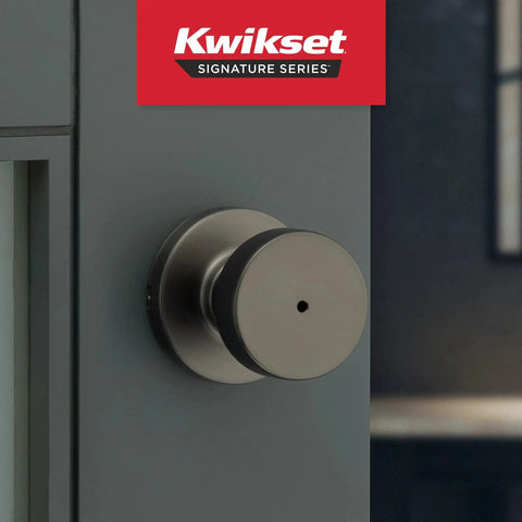 Pismo Interior Round Privacy Door Knob With Lock in gunmetal finish on a door, featuring push button privacy lock.