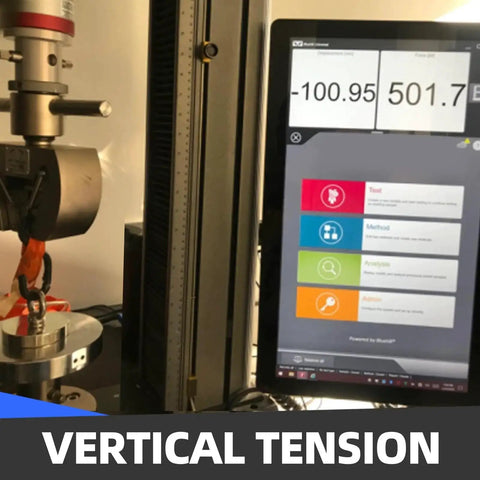 Vertical tension testing machine with digital display showing results on screen.
