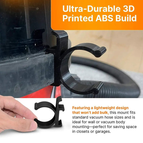 Close-up of ABS plastic vacuum hose holder clip installed on a vacuum for secure storage, featuring universal fit for Henry, George, James.