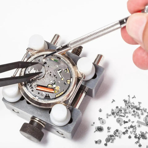 Watch repair showing micro mechanics and 100 Piece Micro Watch Screw Kit With Copper Battery Clamp Screws Replacement Set