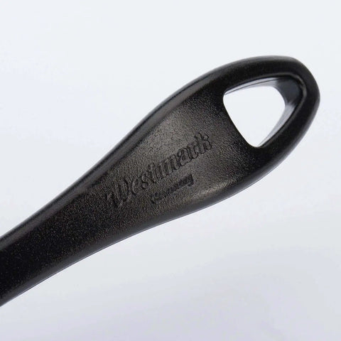 Close-up of the handle labeled Westmark, part of the Garnetta Crinkle Cutter For Zigzag Slices Perfect For Cheese And Veggies Stainless Steel Blade Made In Germany Dishwasher Safe Durable Westmark Kitchen Tool For Fun Even Cuts And Easy Food Prep.