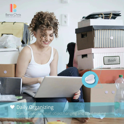 Woman organizing with a laptop surrounded by boxes featuring Hook And Loop Dots Set 500 Pairs 0.59 Inch Nylon Self Adhesive For Classrooms.
