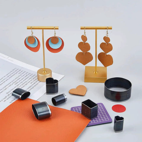 DIY Leather Die Cutting Kit 16Pcs Punch Cutter Set With Hearts Rectangles Rounds And Hollow Punches For Jewelry Making Handmade Craft Projects Includes PVC Cutting Mat Pad, leather shapes, and dies on display