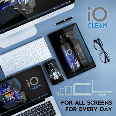 Eyeglass Lens Cleaner Spray Kit For Glasses And Screens With 2 Microfiber Cloths displayed with glasses and digital devices