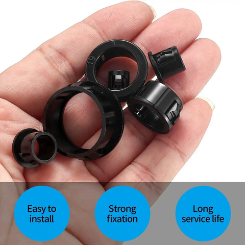 Hand holding various sizes of black nylon cable snap grommets from the 170 Pcs Black Round Nylon Cable Snap Grommets Set Durable PA66 Material