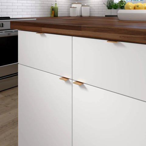 Kitchen cabinets with 1-Inch Center-To-Center Satin Gold Modern Cabinet And Drawer Edge Pull Handle, wood countertop