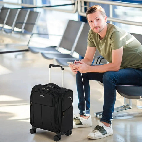 Man sitting in airport with Underseat 16 Inch Carry On Luggage With Wheels Softside Personal Item Bag For Travel HanTrip 30L Capacity.