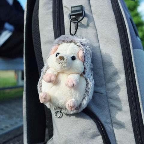 Plush hedgehog keychain attached to backpack with Eight Pack D Shape Carabiner Clips With Screw Gate Two Point Two Inch Aluminum Alloy Key Chain Buckle Mini Keyring Hook For Grab N Go Outdoor Hiking Travel Not For Climbing.