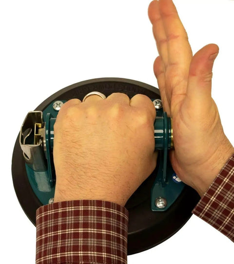 Demonstrating use of 8 Inch Flat Vacuum Suction Cup With Metal Handle And Hand Pump, featuring a non-slip grip in action.