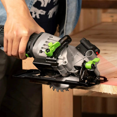 Person using Powerful 4 Amp 3500 RPM Circular Saw With Laser Guide For Clean, Precise Cuts on wood edge in workshop setting.