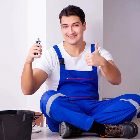 Technician holding Two Pack Electric Control Cabinet Keys Set With Double Joint Cabinet Panel Keys, seated in blue workwear.
