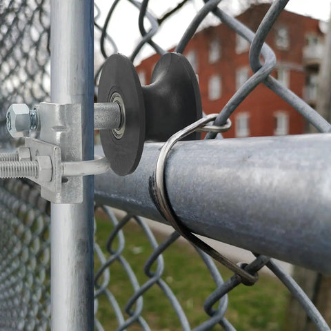 2 Pcs Chain Link Nylon Rolling Gate Track Wheel Rollers For Sliding Gates Compatible With 2 Inch Gate Frames And One And Five Eighths Inch Track Pipe With Galvanized Steel Cantilever Hardware installed on a fence