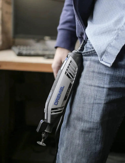 Person using a Dremel rotary tool with Three Jaw Keyless Drill Chuck Collet Set For Rotary Tools One Thirty Second To One Eighth Inch Shanks