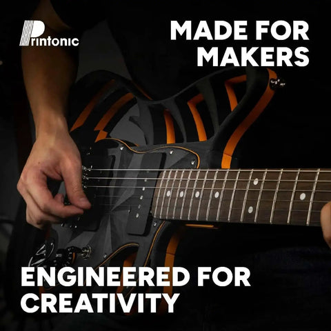 Person playing custom electric guitar with black and orange design, text reads 'Made for Makers, Engineered for Creativity'