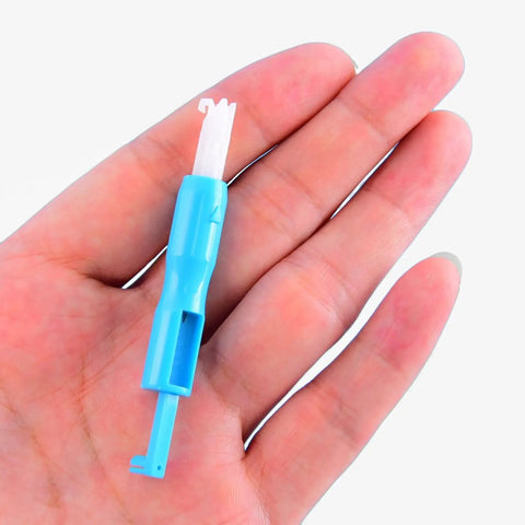 Hand holding blue Hicarer needle inserter from Automatic Needle Threader For Sewing Machines 6 Pack Blue And White
