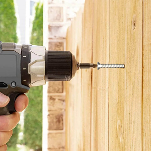 Power drill installing Size 14 Wood Screws Two And Three Quarter Inch 100 Count Stainless Steel 304 Self Tapping Flat Head Phillips For Woodworking And Drywall Projects Built Tough And Rust Resistant into wooden surface outdoors.