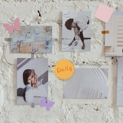 Wall display with photos and butterfly decorations showcasing uses of Five Set Metal Cutting Dies And Stencil Kit With Thirty Two Pcs Templates