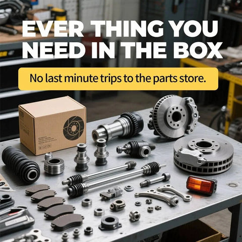 Assorted automotive parts kit including hub assembly, brake pads, and rotors on a workshop table.