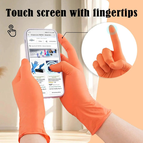 Person wearing Nitrile Disposable Gloves Orange 3.5mil Medium using a smartphone, illustrating touch screen capability.