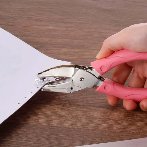 Using Dual Size Circle Hole Punch Set for Paper Craft with pink soft grip; 1/16" and 1/8" holes on paper, DIY tool for scrapbooking.